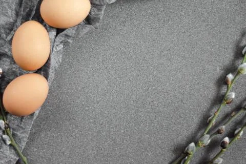 Composition of willow twigs and eggs on a granite surface, copy space. Stock Photos