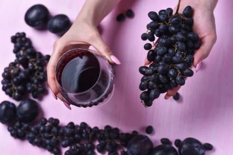 Composition of wine, grape and plums Stock Photos