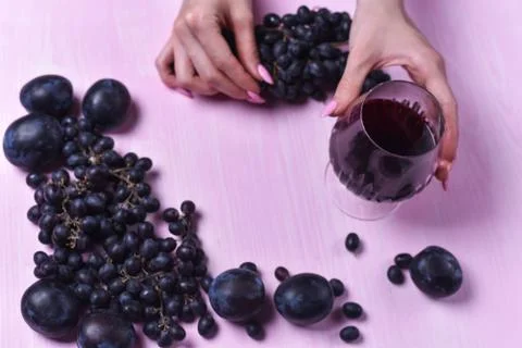 Composition of wine, grape and plums Stock Photos