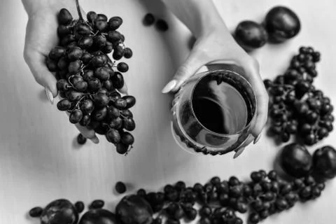 Composition of wine, grape and plums Stock Photos