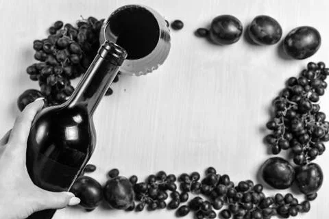 Composition of wine, grape and plums Stock Photos