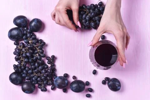 Composition of wine, grape and plums Stock Photos