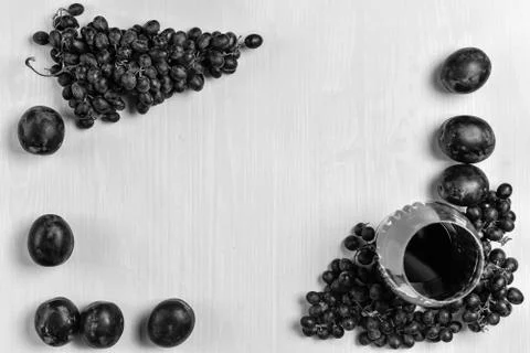 Composition of wine, grape and plums Stock Photos
