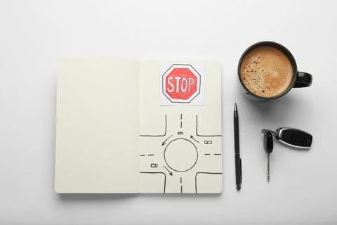 Composition with workbook for driving lessons on white background, top view.  Stock Photos