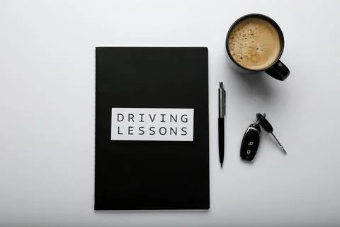 Composition with workbook for driving lessons on white background, top view.  Stock Photos