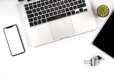 Composition of workspace, with blank screen smartphone top close view. Stock Photos