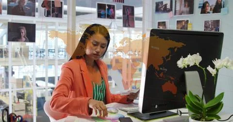 Composition of world map and data processing over asian businesswoman using Stock Photos
