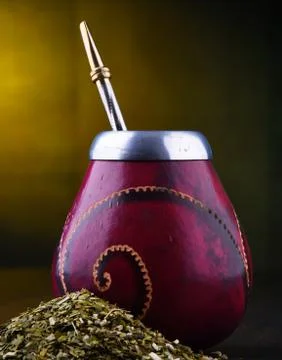 Composition with yerba mate cup and leaves. Stock Photos