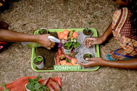 Compost and composted soil cycle as a composting pile of rotting kitchen sc.. Stock Photos