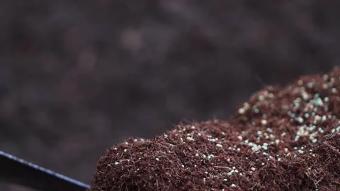 Compost being prepared with fertilizer Stockbeeldmateriaal 168240935