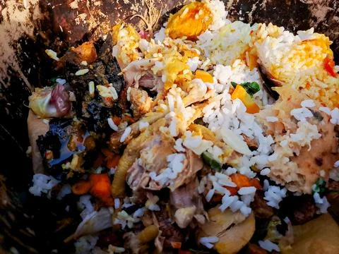 Compost bin filled with kitchen scraps, fruit peels, and vegetable waste, r.. Stock Photos