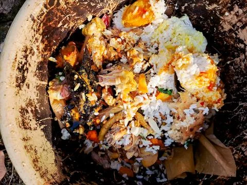 Compost bin filled with kitchen scraps, fruit peels, and vegetable waste, r.. Stock Photos
