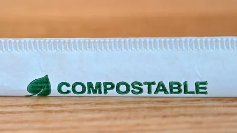 Compostable green sign on a straw package Stock Footage 202097265