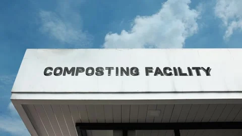 Composting facility word sign displayed on building with blue sky background Stock Footage 318578266