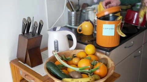 Composting Kitchen Waste at Home, Adding Banana Peel to Organic Compost Bin 库存影片 332301014