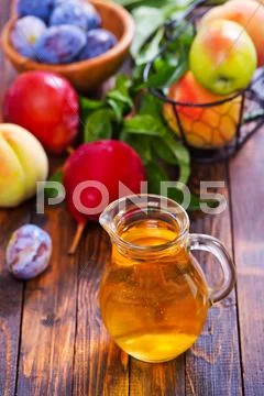 Compot in glass jug on a table Stock Photos