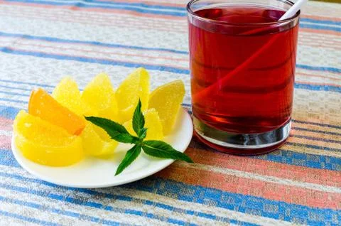 Compote and fruit candy on a cloth. Stock Photos
