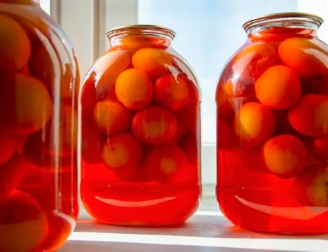 Compote of plums Stock Photos