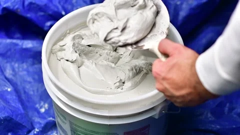 Compound for drywall mixing use Stock Footage 255663852