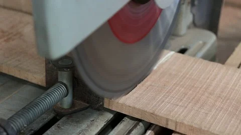 Compound miter saw cutting a piece of wood in carpentry workshop Stock Footage 79483016