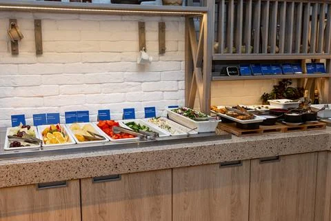 Comprehensive Breakfast Buffet Featuring Fresh Vegetables and Variety of Di.. Stock Photos