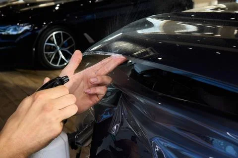 The comprehensive Car Wrap Application Process conducted within a Modern Stock Photos
