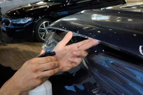 The comprehensive Car Wrap Application Process conducted within a Modern Stock Photos