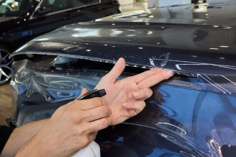 The comprehensive Car Wrap Application Process conducted within a Modern Stock Photos