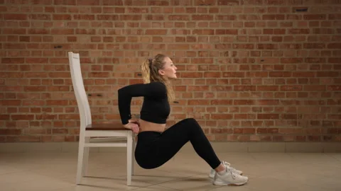 Comprehensive Chair Dips Exercise Tutorial by Fitness Expert for Arm Toning 動画素材 264776341