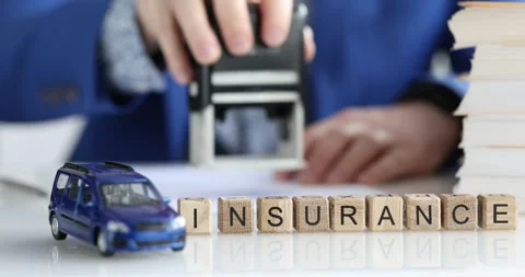 Comprehensive Insurance Documentation Accompanied by a Miniature Car Model Stock Footage 295051419