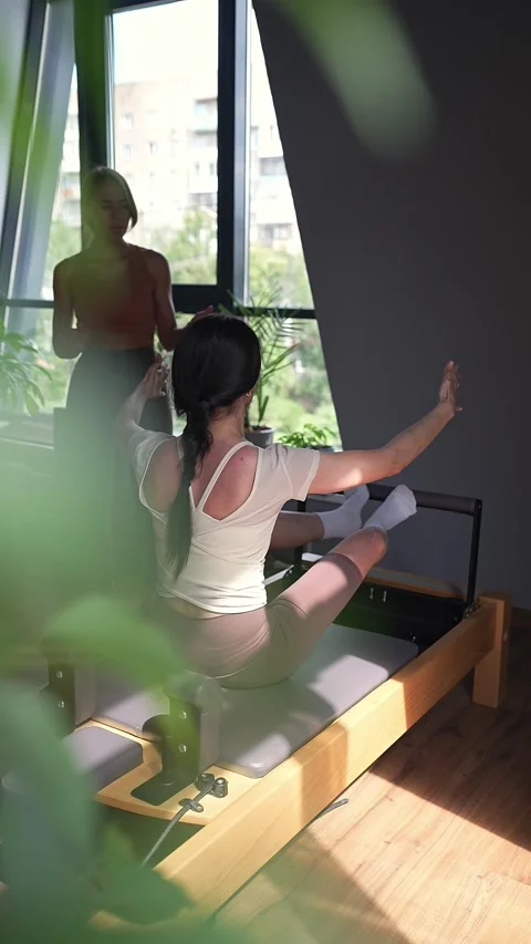 Comprehensive Pilates training session that includes essential posture Stock Footage 294598049