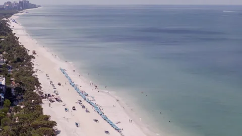 Compressed aerial drone shot of Naples Florida beach and coastline Stock Footage 334870644
