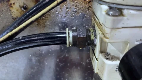Compressed Air Leak at Pneumatic Regulator Thread Connection Stock Footage 339042368