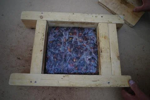 Compressed block in wooden frame 写真素材