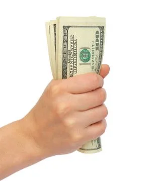 Compressed bundle of dollars a female hand Foto stock