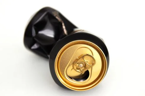 Compressed can isolated on a white background, Aluminum recycling old cans. Stock Photos