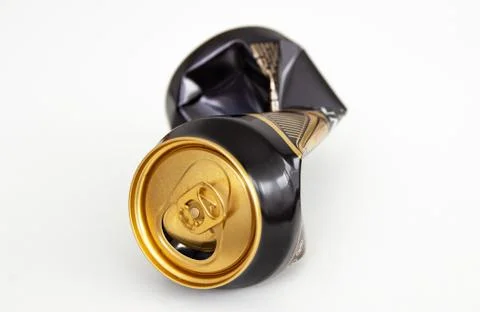 Compressed can isolated on a white background, Aluminum recycling old cans. Stock Photos
