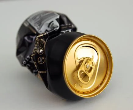 Compressed can isolated on a white background, Aluminum recycling old cans. Foto stock