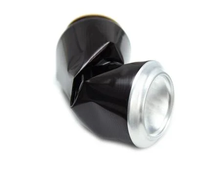 Compressed can isolated on a white background, Aluminum recycling old cans. Stock Photos