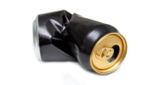 Compressed can isolated on a white background, Aluminum recycling old cans. Stock Photos