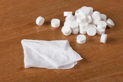 Compressed coin tissues and spreaded out tissue Stock Photos