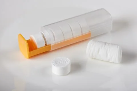 Compressed coin tissues with its case Stock Photos