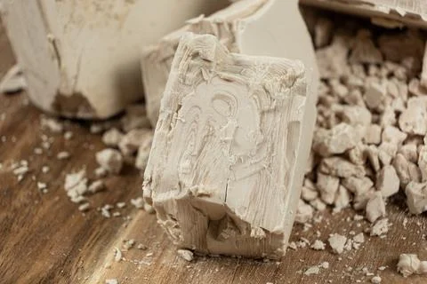 Compressed fresh yeast cubes close-up on a wooden background. Stock Photos
