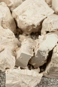 Compressed fresh yeast cubes close-up Stock Photos