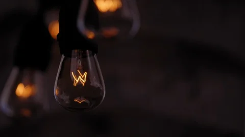COMPRESSED LINE OF STRINGS LIGHTS AT NIGHT, with negative space.  IN 4K Video stock 104934915