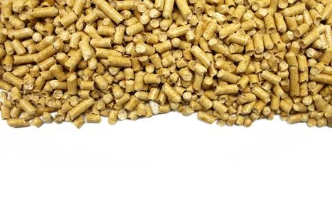 Compressed pine sawdust isolated on white background. Stock Photos