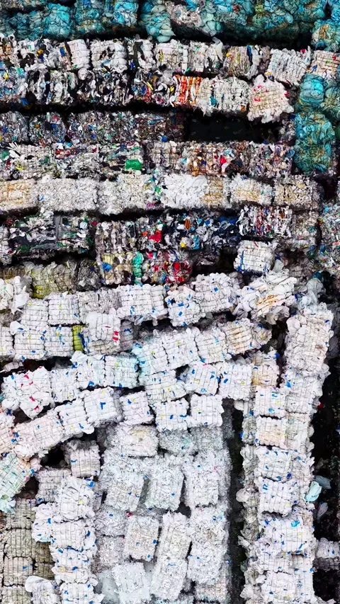 Compressed Plastic and Metal Recycling Bales Forming Abstract Industrial Pattern Stock Footage 342465784