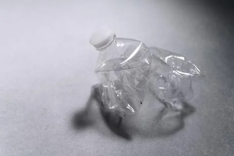 Compressed Transparent Plastic Bottle close-up.Concept of Recycling Garbage Stock Photos
