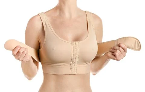Compressing bra with a stipe after breast augmentation. Isolated, clipping path. Foto stock