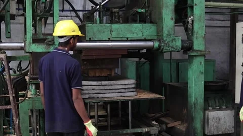 The compression and molding process as the machine forms casting molds from sand Stock Footage 320991435